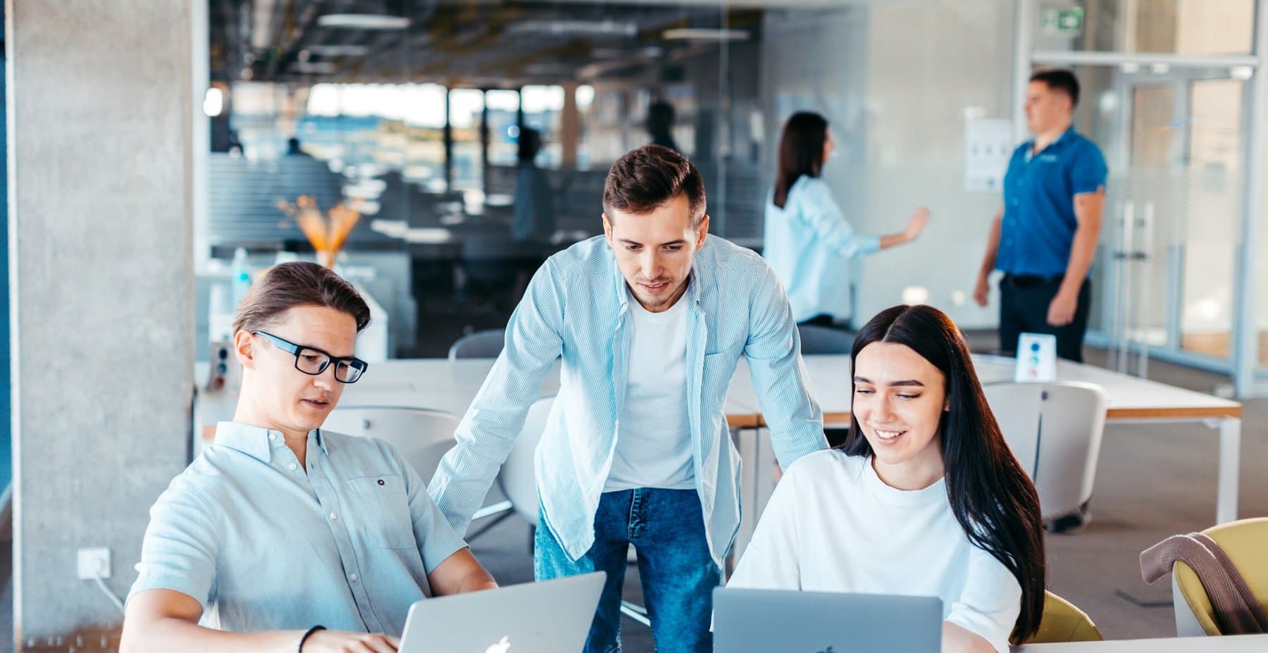 A team working together at a shared desk